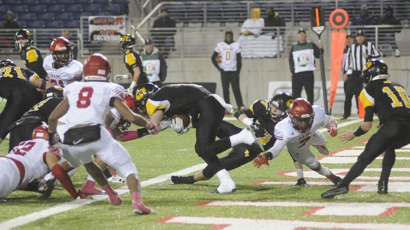 Tri-Valley RB Caleb Craig approaches the goal line and Trotwood defenders. This second-quarter play was not ruled a safety and Tri-Valley QB Andrew Newsom sped 99 yards for a TD on the next play. Trotwood-Madison defeated Dresden Tri-Valley 27-19 to win a D-III high school football state championship at Canton on Sat., Dec. 2, 2017. MARC PENDLETON / STAFF