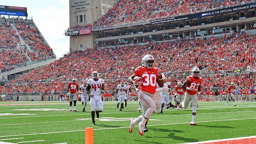 COLUMBUS, OH - OCTOBER 1:  Demario McCall #30 of the Ohio State Buckeyes scores on a 20-yard touchdown run in the third quarter against the Rutgers Scarlet Knights at Ohio Stadium on October 1, 2016 in Columbus, Ohio. Ohio State defeated Rutgers 58-0.  (Photo by Jamie Sabau/Getty Images)