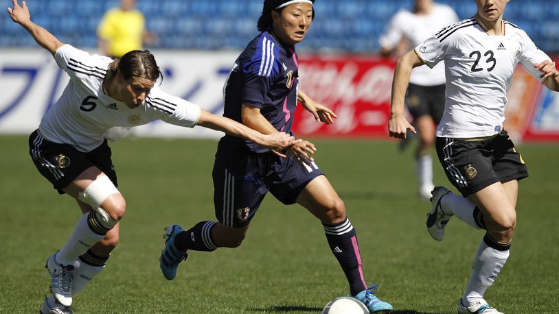 In this March 7, 2012, file photo, Japan's Yuki Nagasato, center, challenges Germany's Annike Krahn, left, and Josephine Henning during the Algarve Cup women's soccer final match at the Algarve stadium outside Faro, southern Portugal. Nagasato won the Women's World Cup with Japan in 2011 and currently plays for the Chicago Red Stars in the NWSL. Now she is joining the Japanese men's club Hayabusa Eleven on loan. (AP Photo/Armando Franca, File)