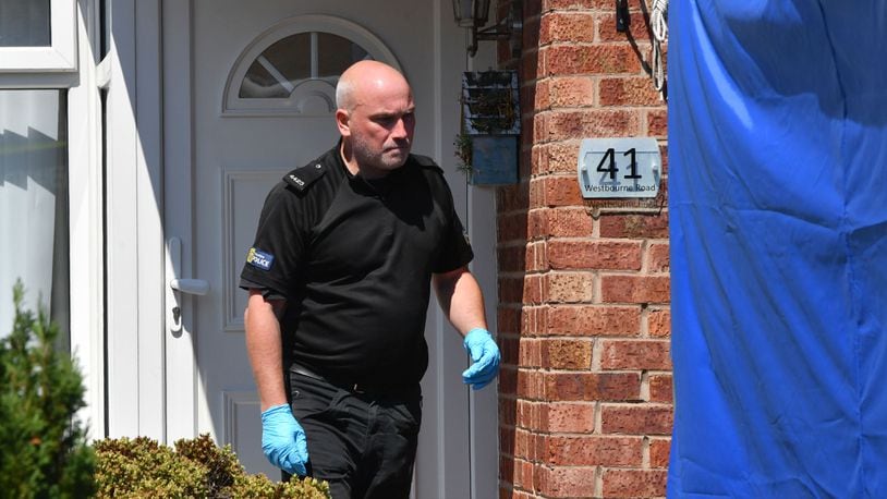 A police officer steps out of 41 Westbourne Road in Chester, England, during a July 3, 2018, search of the home following the arrest of a health care worker at the Countess of Chester Hospital. The unnamed woman was arrested on suspicion of murdering eight babies and attempting to kill six others. Cheshire police detectives have been investigating the deaths of 17 newborns and near-deaths of 15 more that occurred in the hospital’s neonatal unit between March 2015 and July 2016.