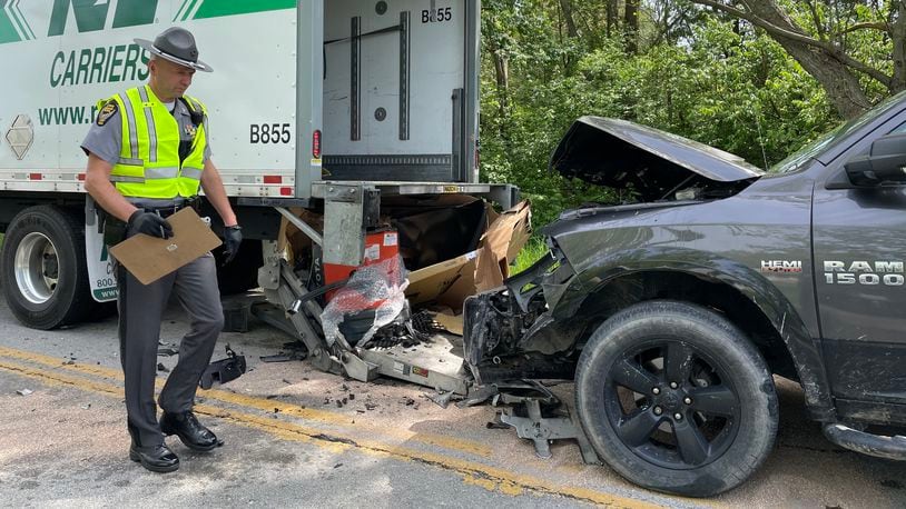 A man delivering a large flat-screen TV was struck by a pickup truck Tuesday, May 10, 2022, while he was standing behind a box truck on Enon Road in New Carlisle. BILL LACKEY/STAFF