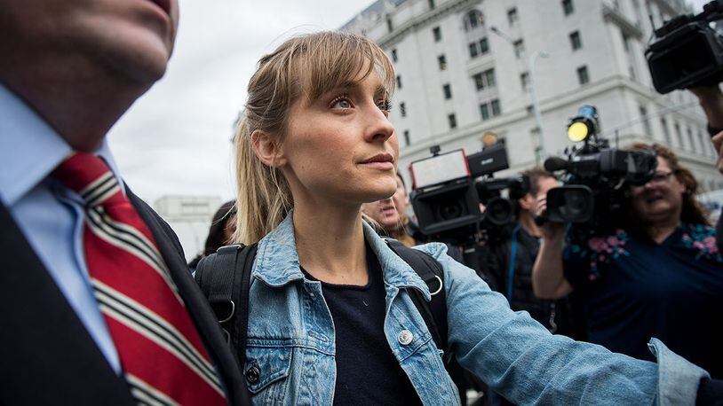 Actress Allison Mack leaves U.S. District Court for the Eastern District of New York after a bail hearing, April 24, 2018. Mack was charged last Friday with sex trafficking for her involvement with a self-help organization for women that forced members into sexual acts with their leader. The group, called Nxivm, was led by founder Keith Raniere, who was arrested in March on sex-trafficking charges. She was released on bail at $5 million. (Photo by Drew Angerer/Getty Images)