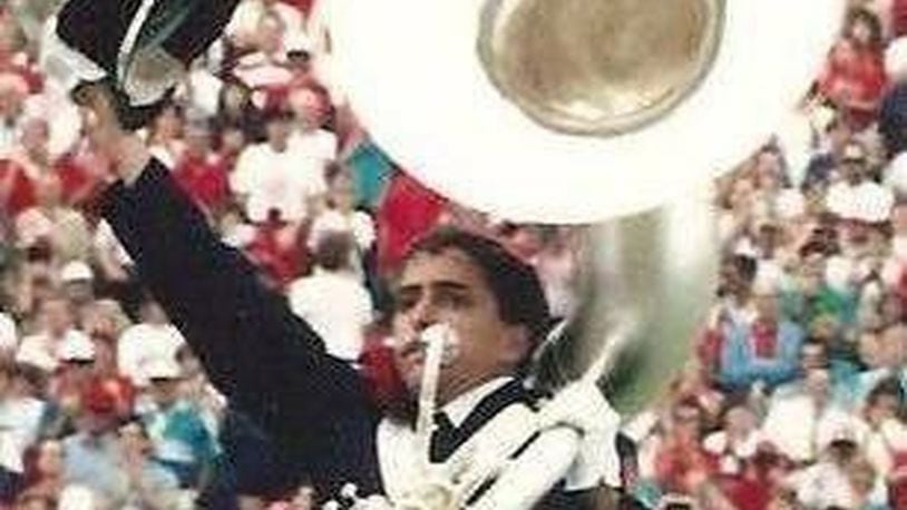 West Carrollton High School grad Darren Montgomery dotted the “i” in Script Ohio as a member of the Ohio State University Marching Band in 1988. CONTRIBUTED