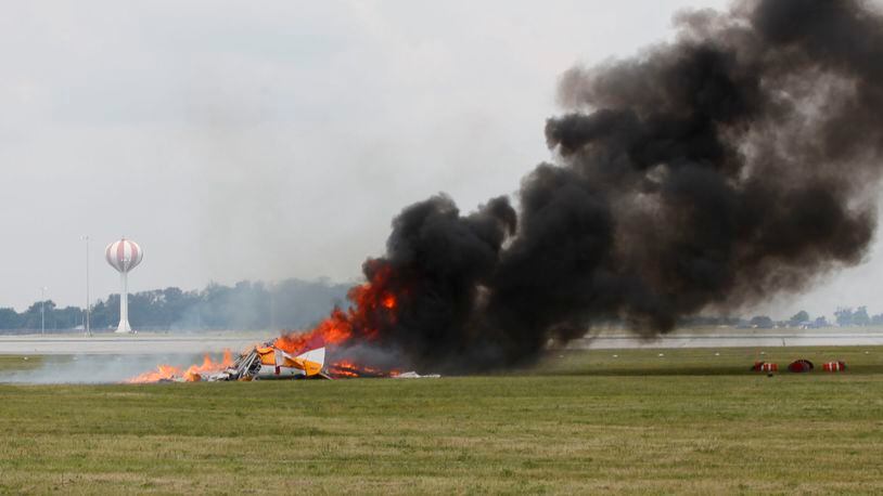 Since 1990, there have been 160 crashes at air shows and air races across America. Not a single year during that time was there not a crash.  Wingwalker Jane Wicker, 46, and pilot Charlie Schwenker, 64, crashed and were killed at the Vectren Dayton Air Show on Saturday, June 22.  The biplane appears to have crashed just inside the 500-foot show line which is marked by orange construction barrels seen at right.  TY GREENLEES / STAFF