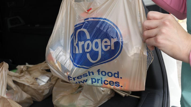 FILE - A customer removes her purchases at a Kroger grocery store in Flowood, Miss., Wednesday, June 26, 2019. The Federal Trade Commission on Monday, Feb. 16, 2024, sued to block a proposed merger between grocery giants Kroger and Albertsons, saying the $24.6 billion deal would eliminate competition and lead to higher prices for millions of Americans.(AP Photo/Rogelio V. Solis, File)