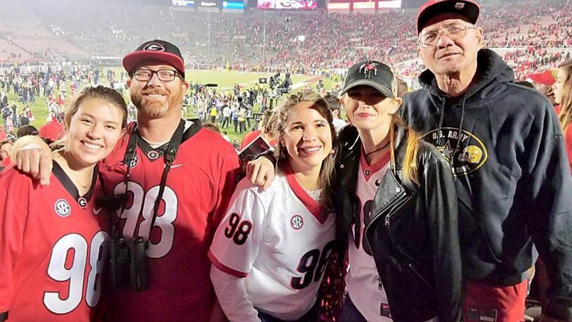 Rodrigo Blankenship's family, which includes, from left, girlfriend Logan Harrell, brother Ken, mother Izabel, sister Trina and father Kenny, had to come from all over the place to get there, but they all made it to Pasadena and the Rose Bowl.