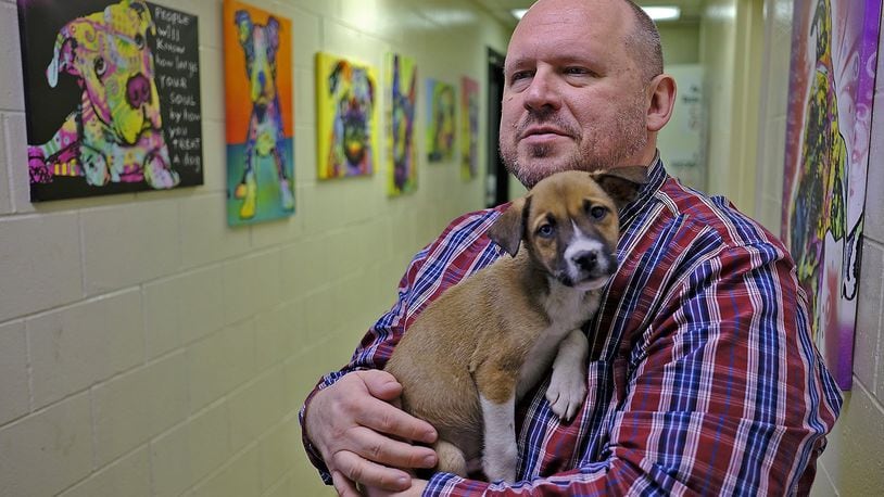 Roger Ganley, Clark County Humane Society director, holds a shephard mixed puppy that’s at the shelter. The Clark County Humane Society is in danger of closing. A fundraising campaign has been started to continue services. Bill Lackey/Staff