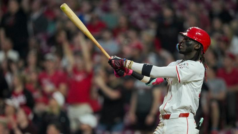 Cincinnati Reds' Elly De La Cruz watches his solo home run during the fifth inning of a baseball game against the Milwaukee Brewers in Cincinnati, Monday, April 8, 2024. (AP Photo/Aaron Doster)