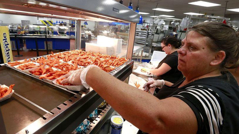 Schools in Clark and Champaign counties work to finalize food service guidelines for the fall. This is Sue Snyder stocking up on food a few years ago at Springfield High School. Bill Lackey/Staff