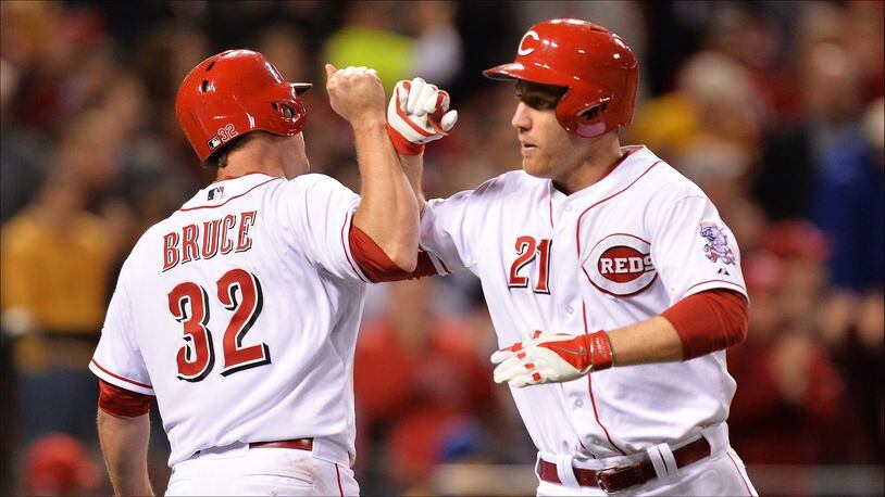 CINCINNATI, OH - MAY 1:  Todd Frazier #21 of the Cincinnati Reds is congratulated by teammate Jay Bruce #32 of the Cincinnati Reds after Frazier hit a two-run home run in the sixth inning against the Milwaukee Brewers at Great American Ball Park on May 1, 2014 in Cincinnati, Ohio. Cincinnati defeated Milwaukee 8-3.  (Photo by Jamie Sabau/Getty Images)