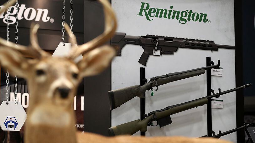 Remington rifles are displayed during the NRA Annual Meeting. On Thursday, The Connecticut Supreme Court ruled that the families of victims killed in the 2012 Sandy Hook Elementary School shooting can sue gun manufacturers, including Remington, for the attack.