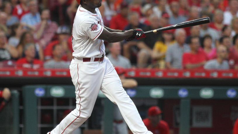 The Reds’ Aristides Aquino hits a home run against the Angels on Tuesday, Aug. 6, 2019, at Great American Ball Park in Cincinnati. David Jablonski/Staff