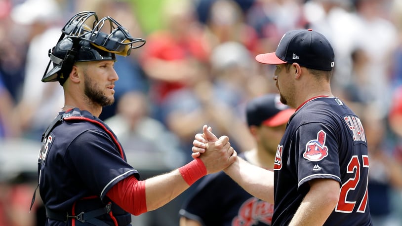 Cleveland Indians' Yan Gomes, left, and Bryan Shaw celebrate after the Indians defeated the Texas Rangers 5-1 in a baseball game, Thursday, June 29, 2017, in Cleveland. (AP Photo/Tony Dejak)