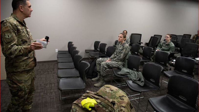 Col. Raymond A. Smith, Jr., 445th Airlift Wing commander, briefs deploying members from the 445th Airlift Wing’s Aerospace Medicine and Aeromedical Staging Squadrons, earlier this week. Airmen from the 445th Airlift Wing were notified this past weekend that they would be mobilized to New York City to help with the COVID-19 pandemic. (U.S. Air Force photo/Mr. Patrick O’Reilly)