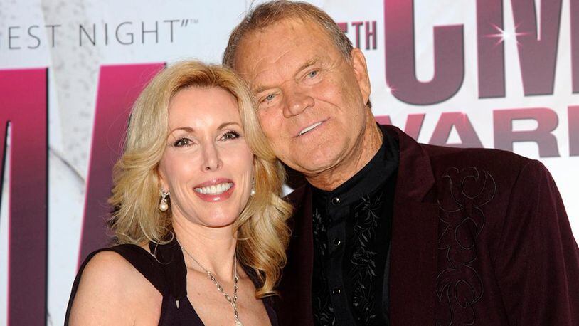 Glen Campbell, right, and his wife, Kim, pose backstage at the 45th Annual CMA Awards in Nashville, Tenn., on Wednesday, Nov. 9, 2011.