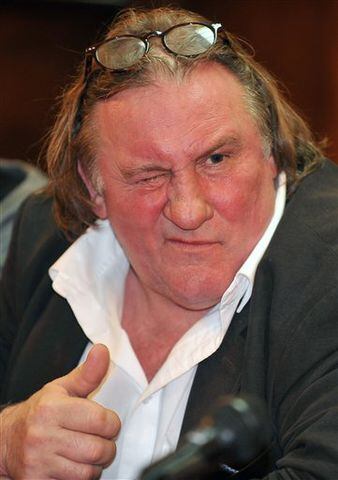 French actor Gerard Depardieu gestures during a press conference with Montenegro Prime Minister Milo Djukanovic, in Podgorica, Montenegro.