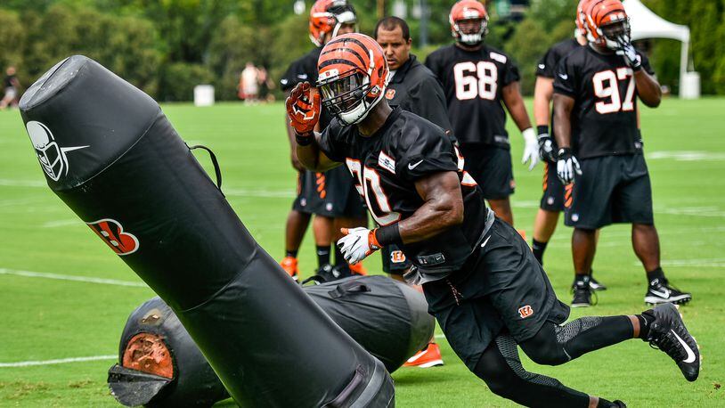 Defensive end Michael Johnson runs through a drill during the first day of Cincinnati Bengals Training Camp Friday, July 28 at the practice fields beside Paul Brown Stadium in Cincinnati. NICK GRAHAM/STAFF