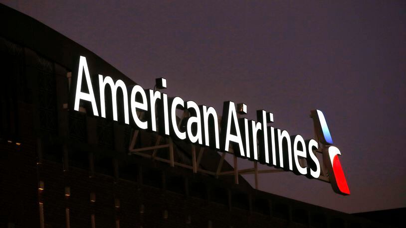 FILE - The American Airlines logo is stands atop the American Airlines Center, Dec. 19, 2017, in Dallas. The pilots' union at American Airlines says there has been “a significant spike” in safety issues at the airline, including fewer routine aircraft inspections and shorter test flights on planes returning from major maintenance work. A spokesman said Monday, April 15, 2024, that union officials have raised their concerns with senior managers and were encouraged by the company's response. (AP Photo/Michael Ainsworth, File)