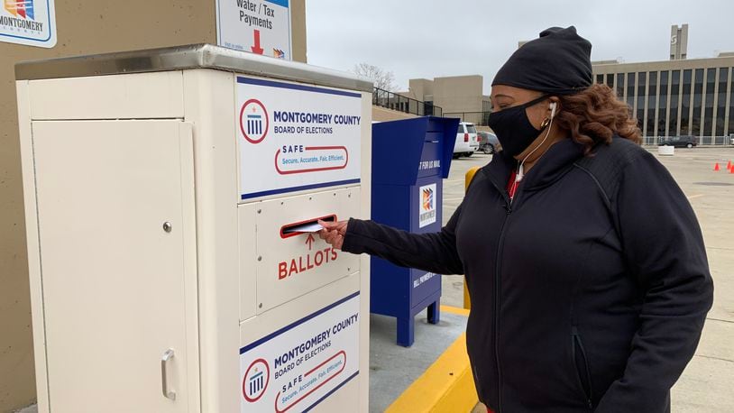 Yolanda Clark of Jefferson Twp. casts her ballot using a drop box at the Montgomery County Board of Elections Wednesday, Oct. 28.