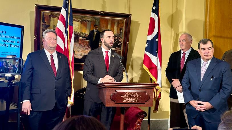 Rep. Adam Mathews, R-Lebanon, outlines a longterm plan to eliminate Ohio's personal income tax. He's joined by Miami Valley's Rep. Brian Lampton, R-Beavercreek; Sen. Steve Huffman, R-Tipp City; and Sen. George Lang, R-West Chester. January 23, 2024.