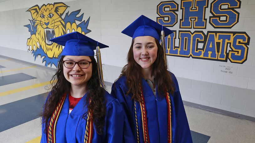 Bobbi-Jo Arnold-Diaz, the Springfield High School valedictorian, left, and Sadie Hatton, the salutatorian, pose for pictures Thursday, May 4, 2023. Fifteen years ago, North and South high schools merged to become Springfield High School. BILL LACKEY/STAFF