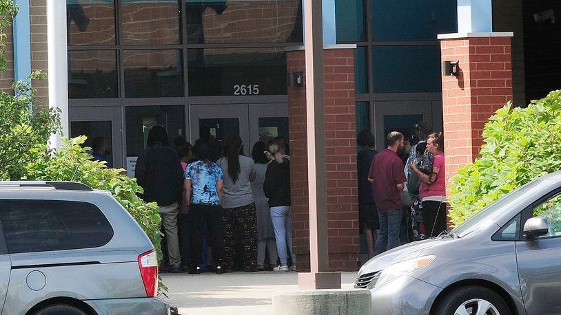 Parents were seen outside Belmont High School after Dayton police received a false report of an active shooter Friday, Sept. 23, 2022. MARSHALL GORBY / STAFF