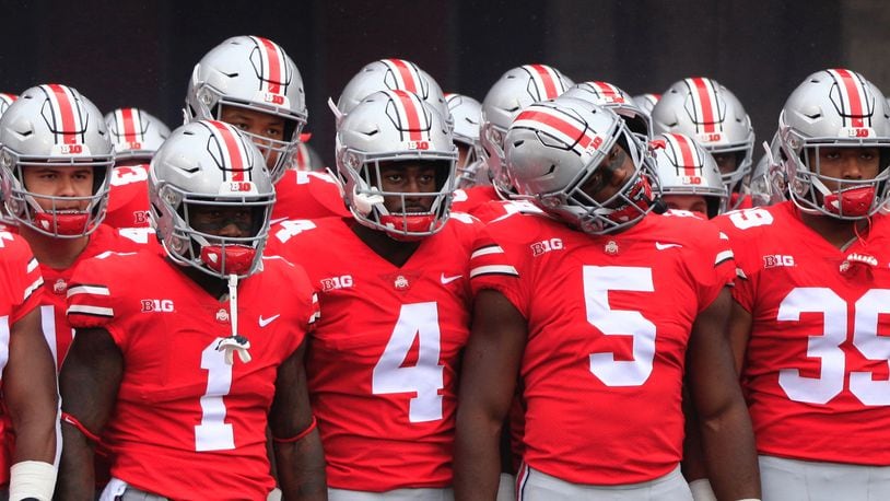 Ohio State players, including Johnnie Dixon (1), Jordan Fuller (4), Baron Browning (5) and Malik Harrison (39), prepare to take the field before a game against Rutgers on Saturday, Sept. 8, 2018, at Ohio Stadium in Columbus. David Jablonski/Staff