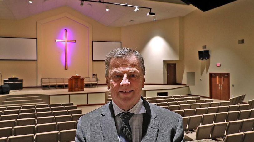 Orbie Estep, senior pastor at Grace Missionary Baptist Church, in the sanctuary of the new 25,000 square foot church. The church, located on the site of the old Kenwood Elementary, is having an open house Saturday for anyone who wants to stop in and see the new church. BILL LACKEY/STAFF