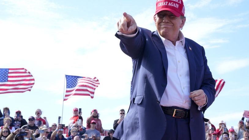 Republican presidential candidate former President Donald Trump gestures to the crowd at a campaign rally Saturday, March 16, 2024, in Vandalia, Ohio. (AP Photo/Jeff Dean)
