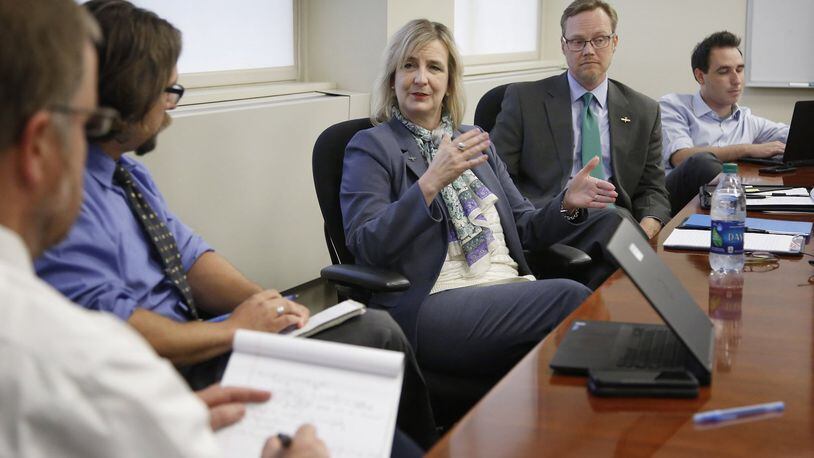 New Wright State University President Cheryl B. Schrader takes questions from content editors at Cox Media Group Ohio. Beside her is university spokesman Seth Baugess. TY GREENLEES / STAFF