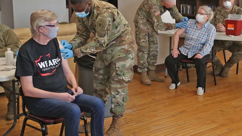 The Clark County Combined Health District is slowly ‘inching up’ to get more vaccinated, but vaccinations in the minority community are still down. Here, National Guard members give senior residents at Shawnee Place Apartments a COVID vaccine shot earlier this year. BILL LACKEY/STAFF
