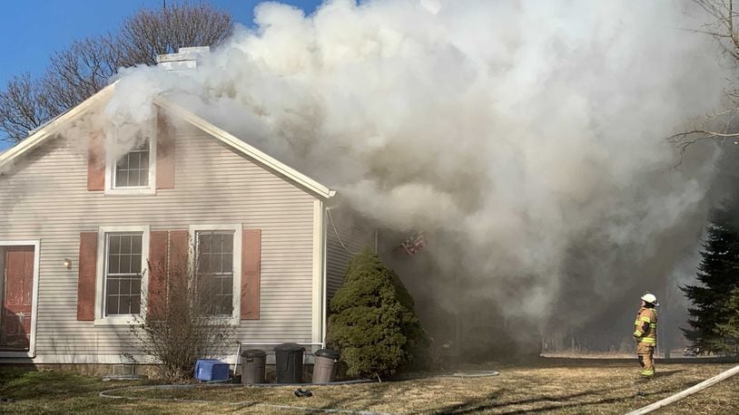 Heavy smoke and flames were reported at at a house fire on New Love Road in Harmony Twp. on Friday, Jan. 29. 2021. BILL LACKEY/STAFF
