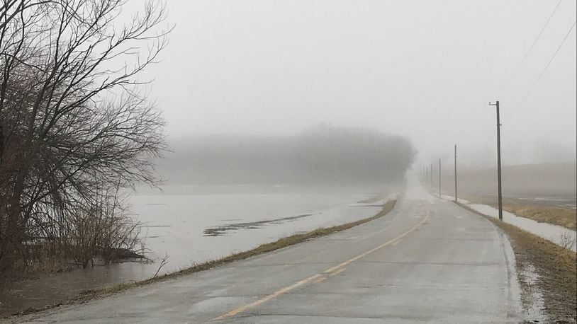 High water along Mitchell Road in Springfield Township Wednesday. ERIC HIGGENBOTHAM/STAFF