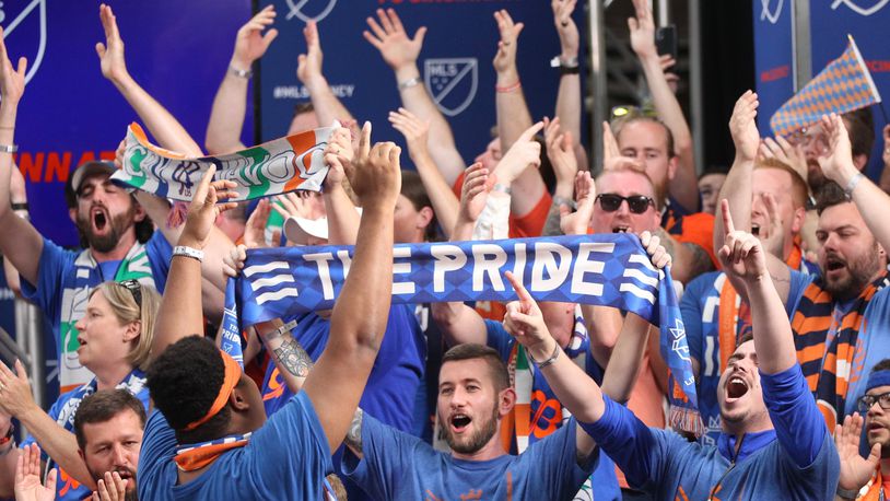 Fans cheer at a press conference where it was announced FC Cincinnati will join Major League Soccer at Rhinegeist Brewery on Tuesday, May 29, 2018, in Cincinnati. David Jablonski/Staff
