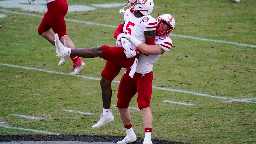Nebraska cornerback Cam Taylor-Britt (5) and linebacker Garrett Nelson (44) celebrate a stop on fourth down against Purdue during the second quarter of an NCAA college football game in West Lafayette, Ind., Saturday, Dec. 5, 2020. (AP Photo/Michael Conroy)