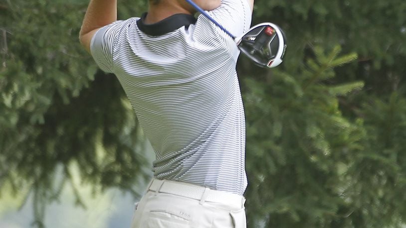 Luke Wells, from Springfield, hits off the fourth tee during Wednesday’s second round of the Ohio Amateur at the Springfield Country Club. Bill Lackey/Staff