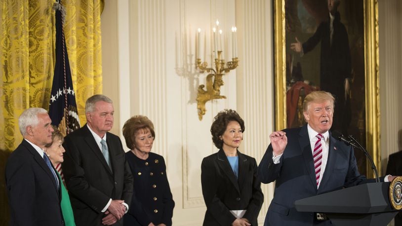 President Donald Trump speaks before signing a decision memo and a letter to members of Congress outlining a plan for privatizing the nation’s air traffic control system, in the East Room of the White House, in Washington, June 5, 2017. At left: Vice President Mike Pence, and second from right, Transportation Secretary Elaine Chao. (Stephen Crowley/The New York Times)