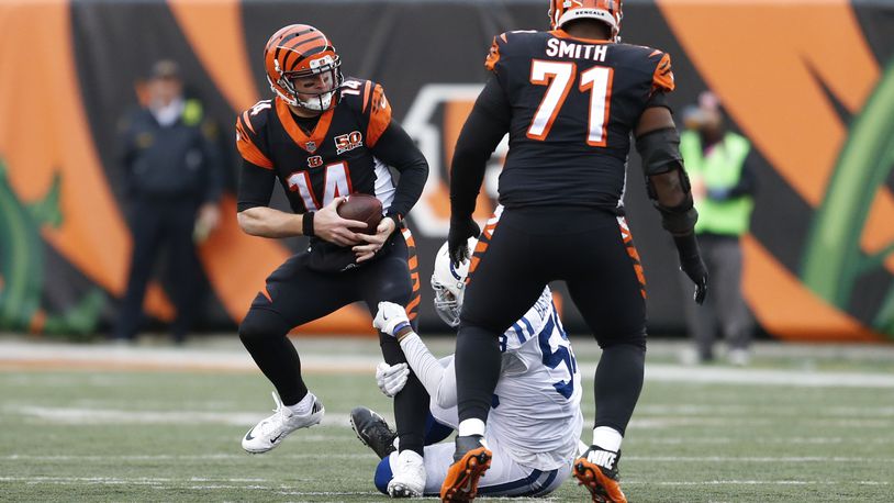 Cincinnati Bengals quarterback Andy Dalton (14) is sacked by Indianapolis Colts linebacker Tarell Basham (58) in the second half of an NFL football game, Sunday, Oct. 29, 2017, in Cincinnati. (AP Photo/Gary Landers)