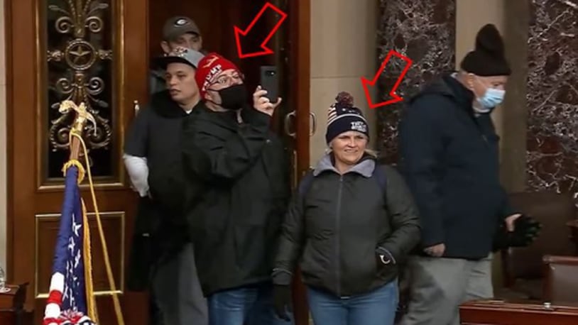 Shawndale Chilcoat (black beanie) and Donald Chilcoat (red beanie), shown in Capitol building security footage entering the Senate chambers. The photo was included in a federal criminal complaint filed with the U.S. District Court for the District of Columbia.