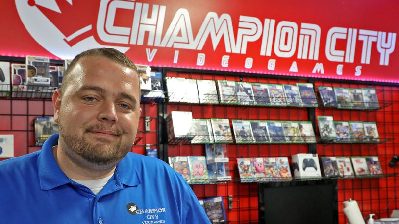 Kenneth Seelig, owner of Champion City Video Games, opened in the Park Shopping Center on Bechtle Avenue recently. BILL LACKEY/STAFF