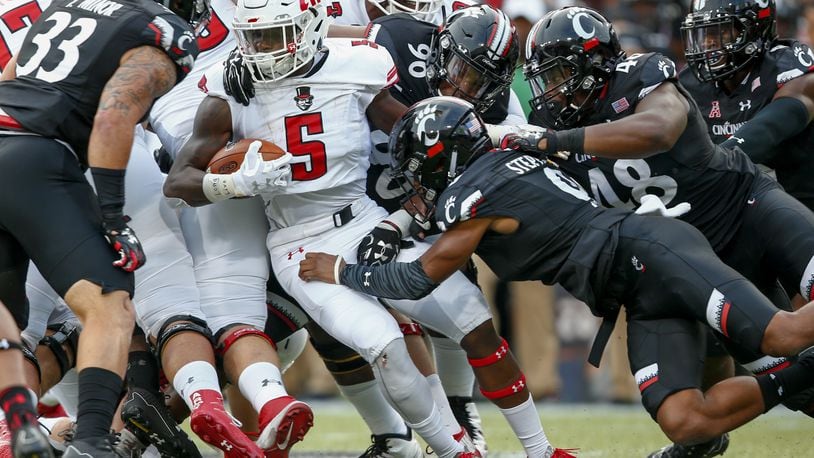Kentel Williams #5 of the Austin Peay Governors runs the ball as Linden Stephens #9 of the Cincinnati Bearcats makes the stop at Nippert Stadium on August 31, 2017 in Cincinnati, Ohio. (Photo by Michael Hickey/Getty Images)