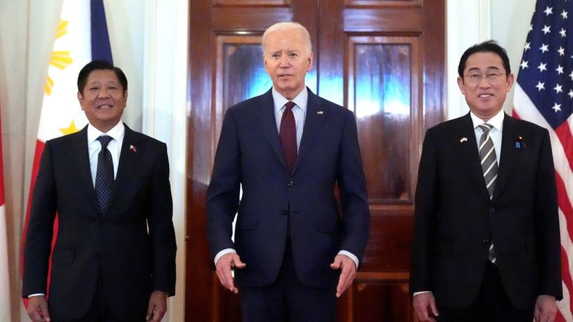 President Joe Biden, center, Philippine President Ferdinand Marcos Jr., left, and Japanese Prime Minister Fumio Kishida pose before a trilateral meeting in the East Room of the White House in Washington, Thursday, April 11, 2024. (AP Photo/Mark Schiefelbein)