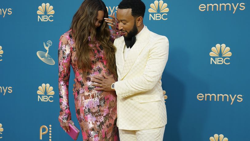 Chrissy Teigen, left, and John Legend arrive at the 74th Primetime Emmy Awards on Monday, Sept. 12, 2022, at the Microsoft Theater in Los Angeles. (AP Photo/Jae C. Hong)