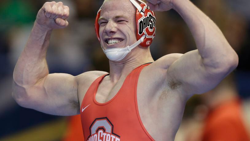 Ohio State’s Bo Jordan celebrates his victory in a 174-pound match in the semifinal round of the NCAA Division I wresting championships, Friday, March 17, 2017, in St. Louis. (AP Photo/Tom Gannam)