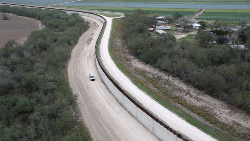 MCALLEN, TX - JANUARY 05: A U.S. Border Patrol vehicle patrols next to a fence at the U.S.-Mexico border on January 5, 2017 near McAllen, Texas. The number of incoming immigrants surged ahead of the Presidential inauguration of Donald Trump, who has pledged to build a wall along the U.S.-Mexico border. (Photo by John Moore/Getty Images)