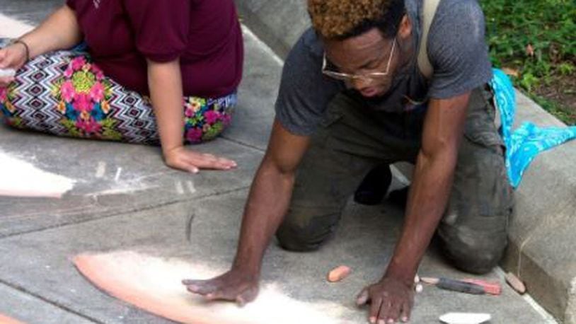 Dayton artist Boy Blue taught several Project Jericho students the possibilities of sidewalk chalk pastels as art over the summer and will be on hand at the first Chalktoberfest competition. CONTRIBUTED