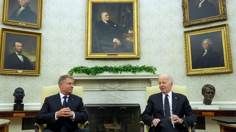 President Joe Biden meets with Romania's President Klaus Iohannis in the Oval Office of the White House, Tuesday, May 7, 2024, in Washington. (AP Photo/Alex Brandon)