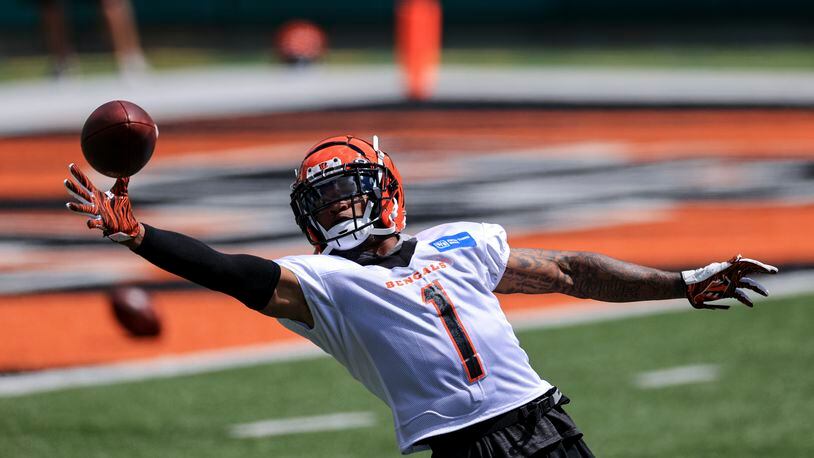 Cincinnati Bengals' Ja'Marr Chase makes a catch as he runs a drill during an NFL football minicamp practice in Cincinnati, Tuesday, June 15, 2021. (AP Photo/Aaron Doster)