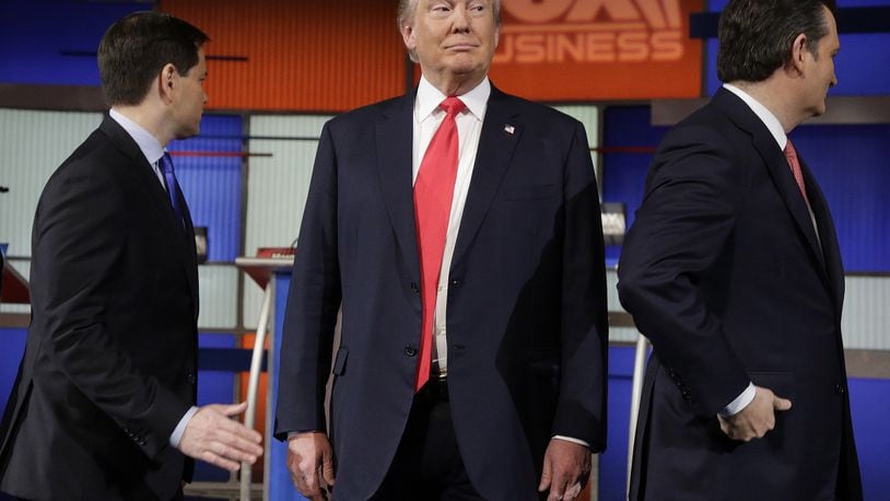 Republican presidential candidate, businessman Donald Trump stands on the stage before the Fox Business Network Republican presidential debate at the North Charleston Coliseum, Thursday, Jan. 14, 2016, in North Charleston, S.C. (AP Photo/Chuck Burton)