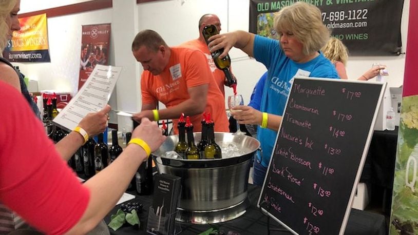 This was taken at the first-ever Vintage Ohio South wine festival that was held from 1 p.m. to 8 p.m. Saturday, May 12, 2018 inside a facility at the Clark County Fairgrounds in Springfield. The festival celebrated local wineries and wines from all over the state. MARK FISHER/STAFF